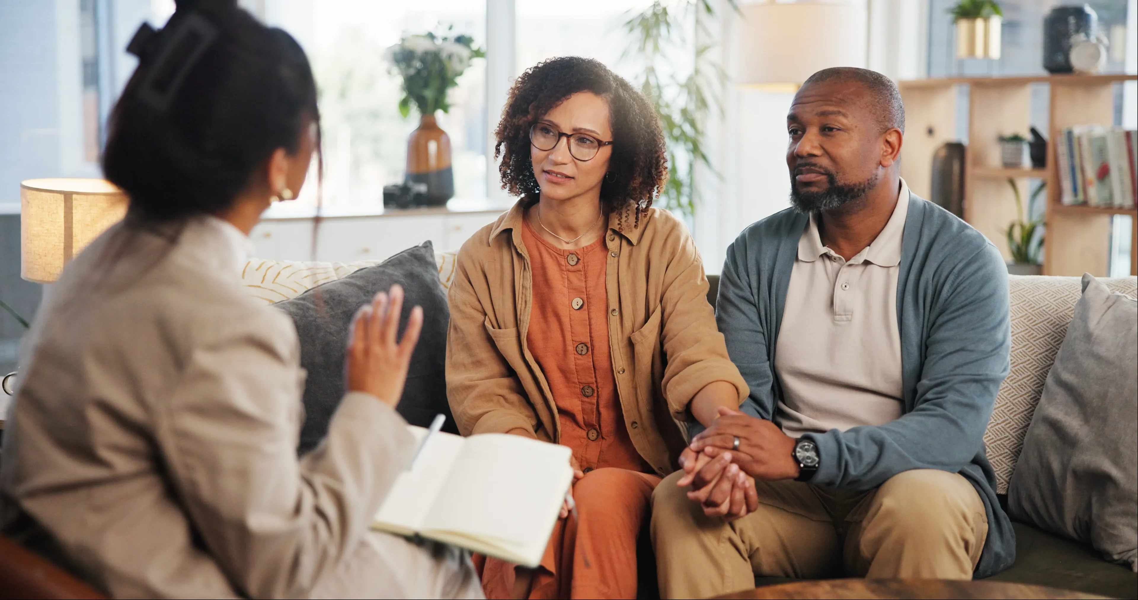 Couple in discussion with a therapist.