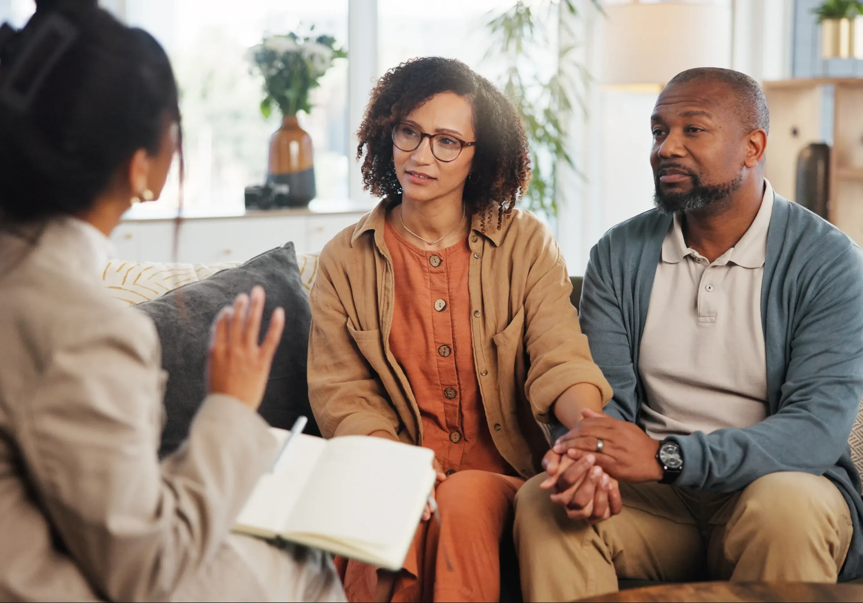 Couple in discussion with a therapist.